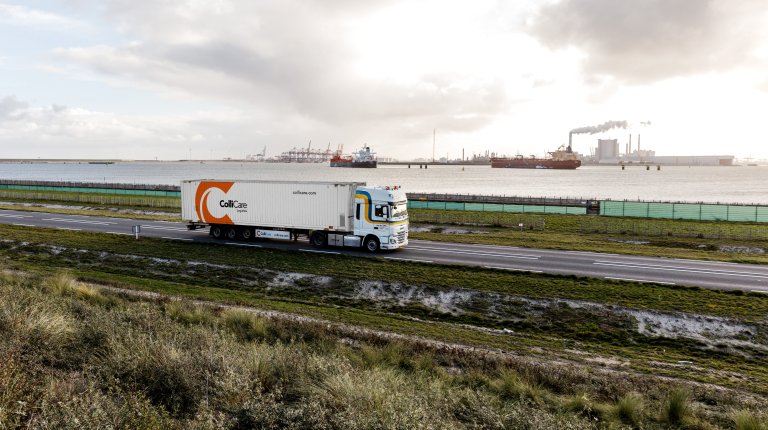 A van der Stek truck driving with a ColliCare container at the Maasvlakte, Rotterdam, Netherlands.