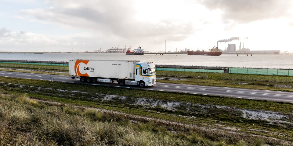 A van der Stek truck driving with a ColliCare container at the Maasvlakte, Rotterdam, Netherlands.